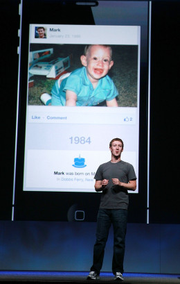 SAN FRANCISCO, CA - SEPTEMBER 22: Facebook CEO Mark Zuckerberg shows a photo of himself as a baby as he delivers a keynote address during the Facebook f8 conference on September 22, 2011 in San Francisco, California. Facebook CEO Mark Zuckerberg kicked off the conference introducing a Timeline feature to the popular social network. (Photo by Justin Sullivan/Getty Images)